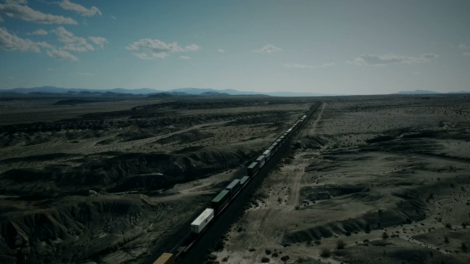 A freight train crossing open desert